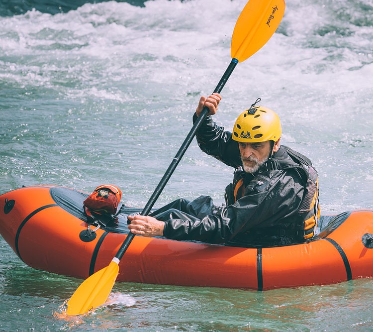 senior man kayaking in BRIS Inflatable Boat