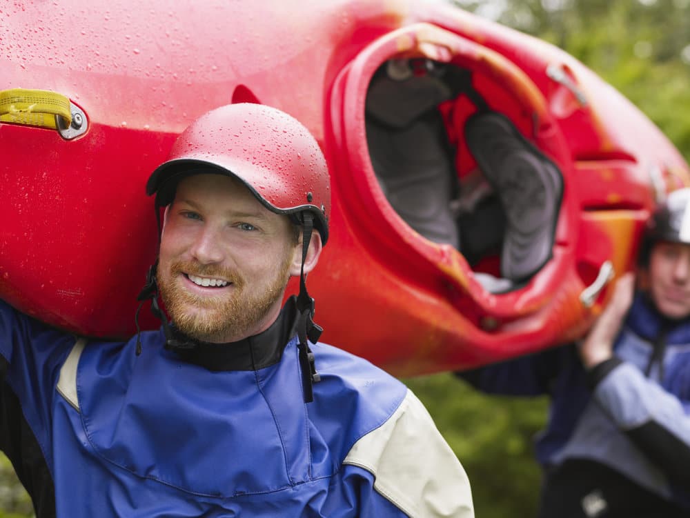 Kayakers Carrying Boat