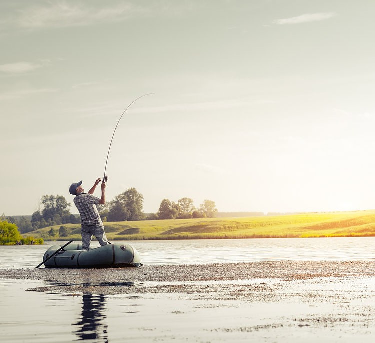 Mature man fishing on the lake