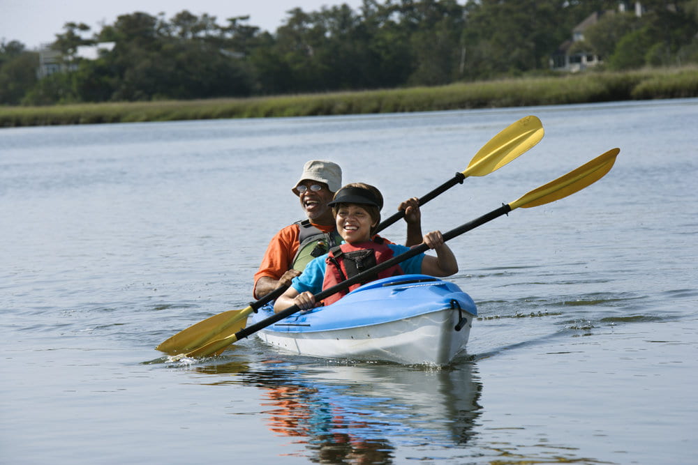 couple kayaking on a river