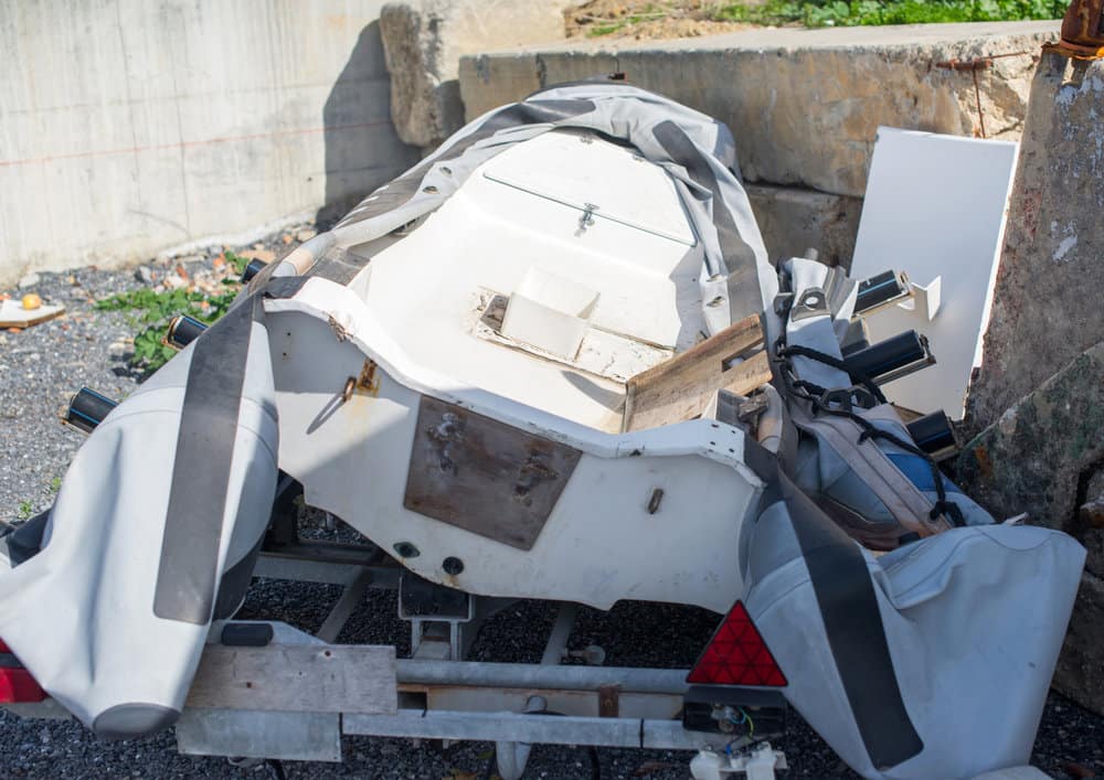 damaged inflatable boat on the shore