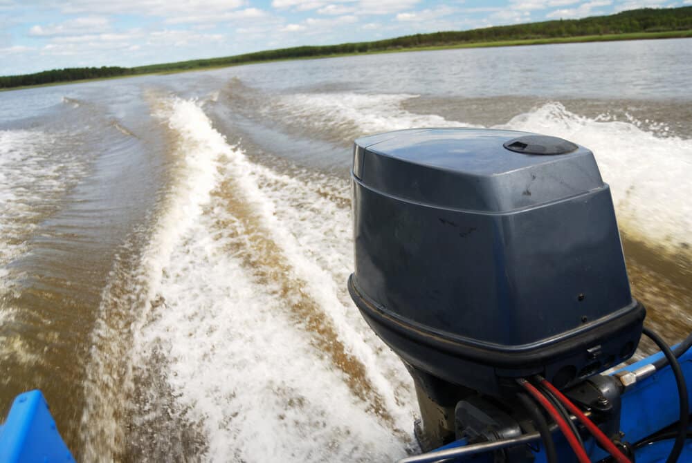 Outboard motor boat on the river