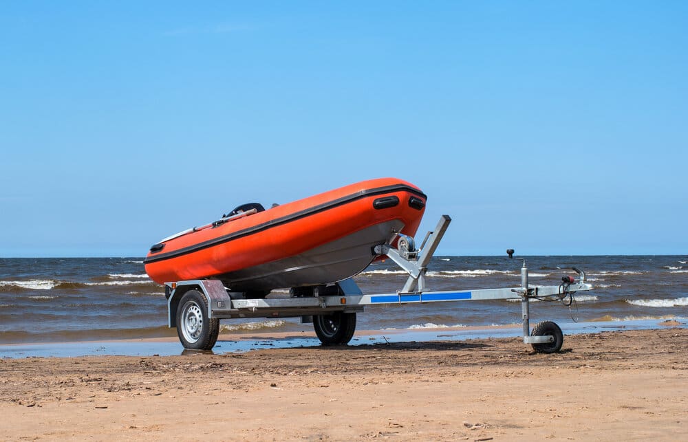 inflatable boat on a trailer on the beach