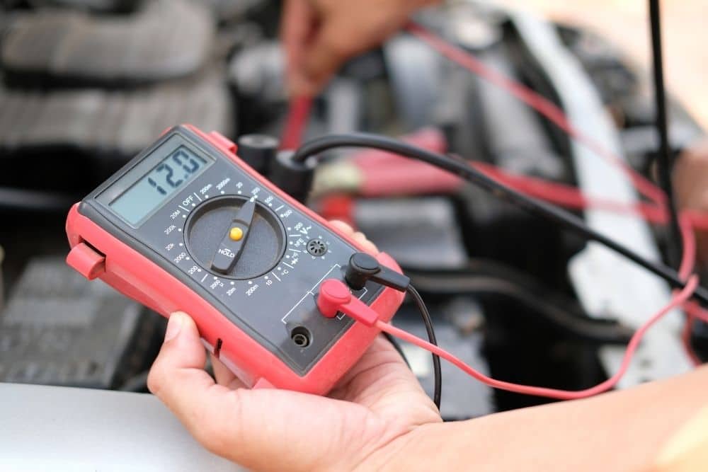 voltmeter checking boat battery voltage