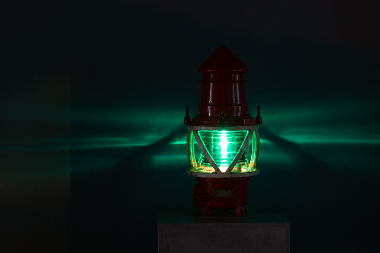 Green light on boat at night