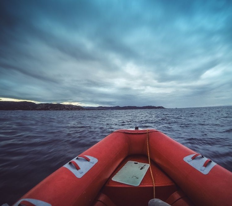 Inflatable boat at sea in windy weather