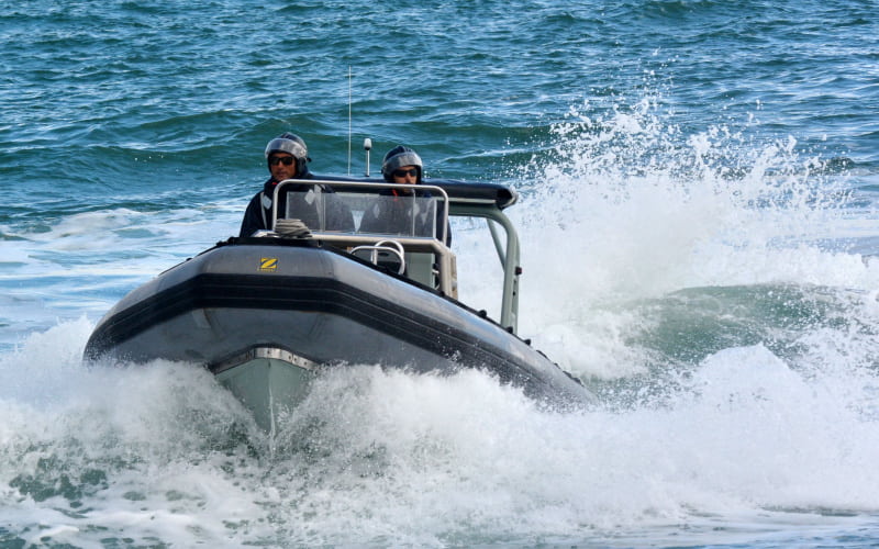 Zodiac Rigid inflatable boat on water at high speed