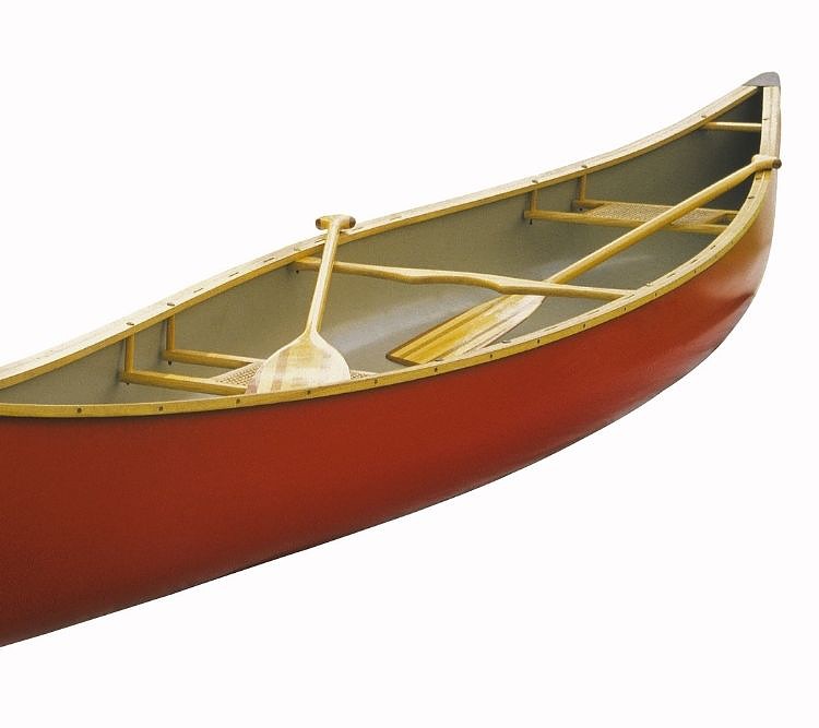 a red canoe with 2 paddles