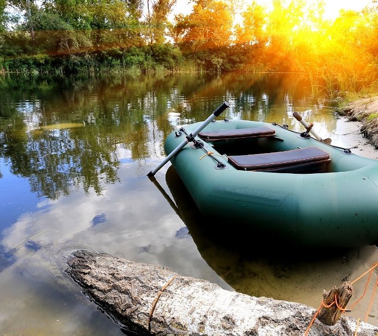 an inflatable boat on a shore