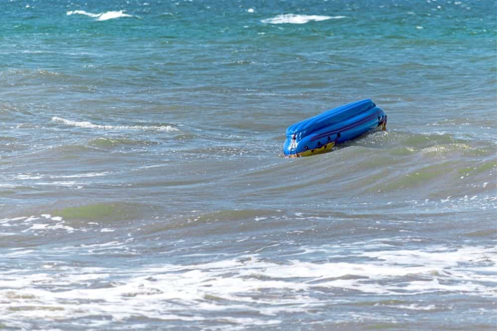 capsized inflatable boat by sharks