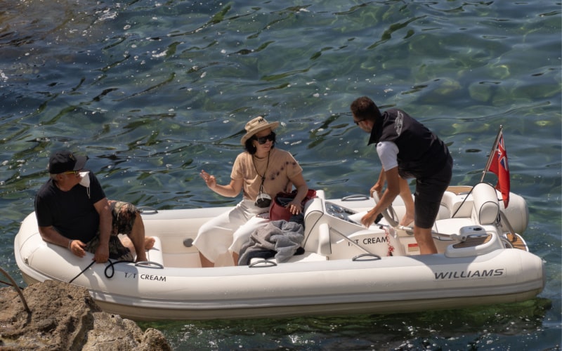 group of three people is going to travel with a Williams Tender inflatable boat