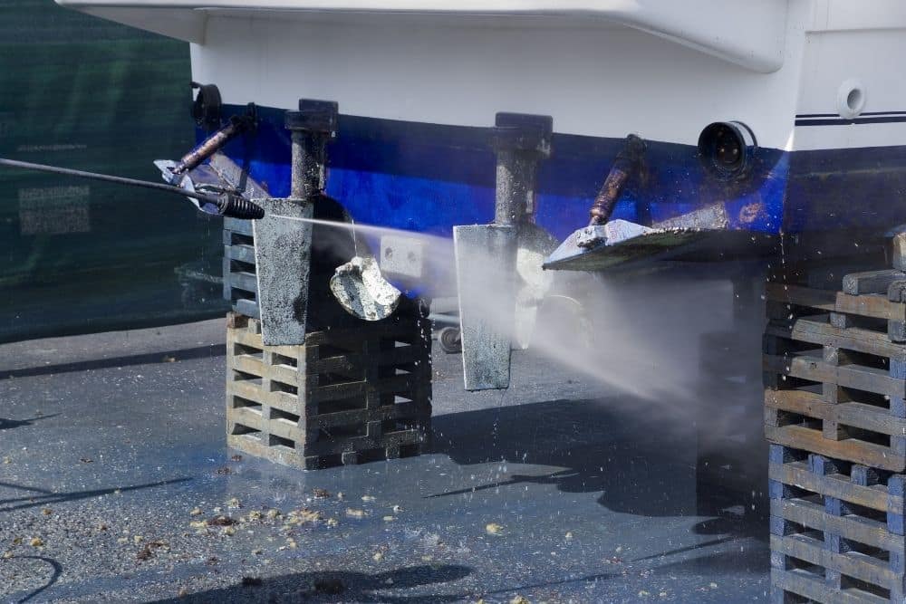 Using pressure washer to remove barnacles