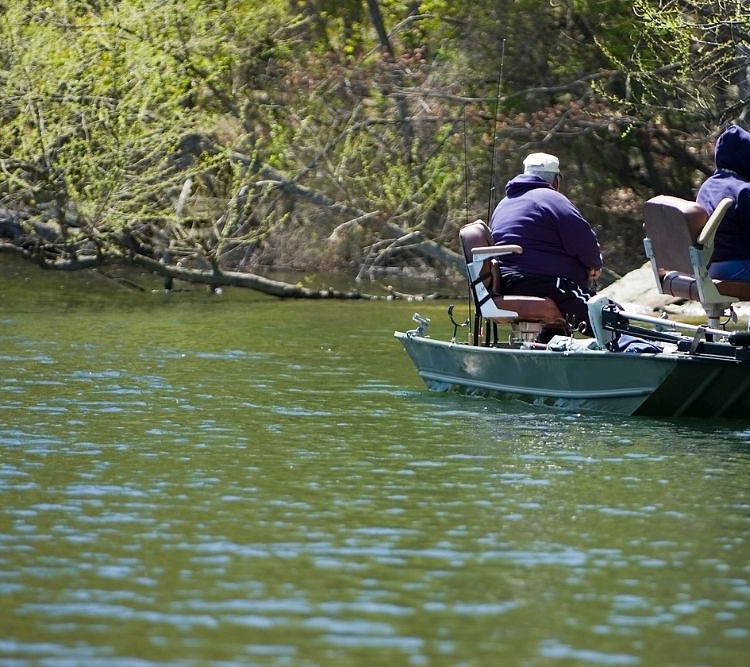 anglers using a trolling motor on a boat