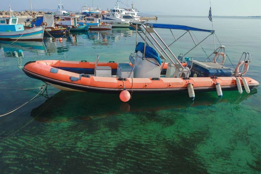 red long rigid inflatable boat at the dock