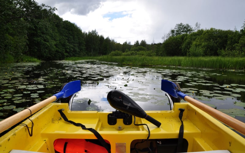 transom trolling motor is installed on a yellow paddle boat