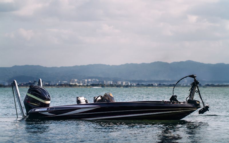 a medium boat is well installed with an outboard motor and bow mount trolling motor