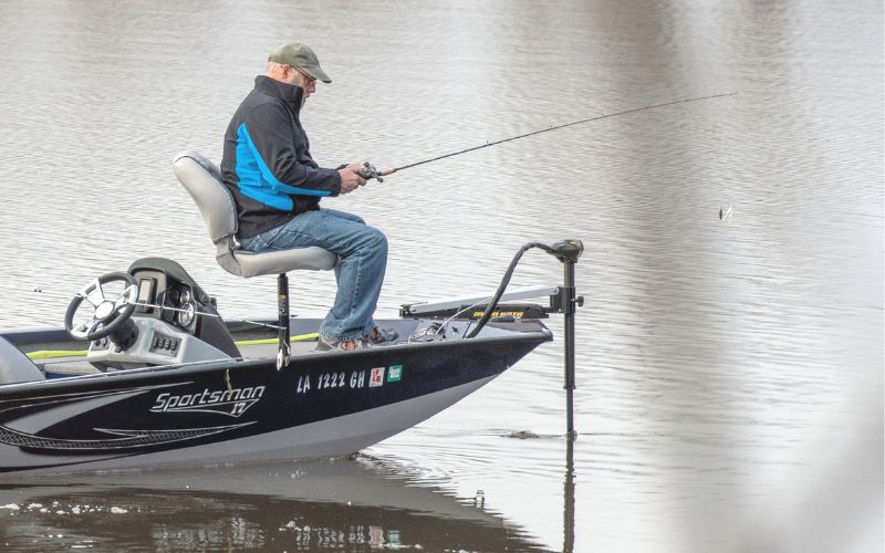 angler sitting on his boat with a Minn Kota trolling motor