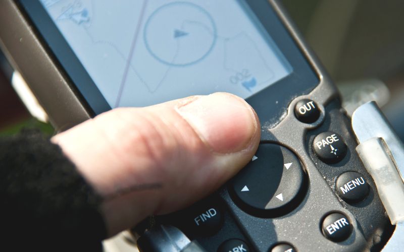 pressing the direction button of a boat gps remote