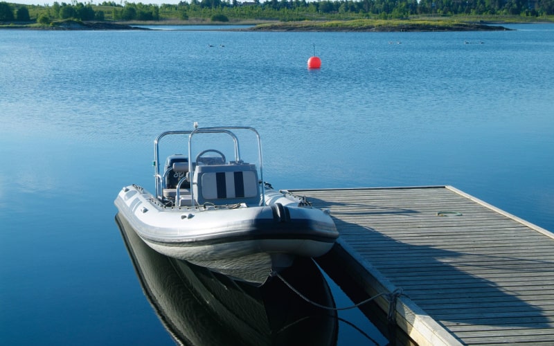 Rigid inflatable boat at a floating dock