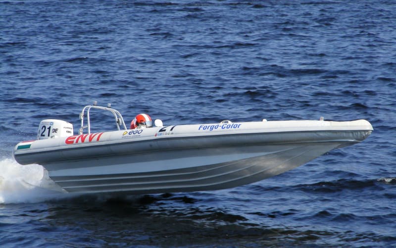 White RIB running in the sea at high speed