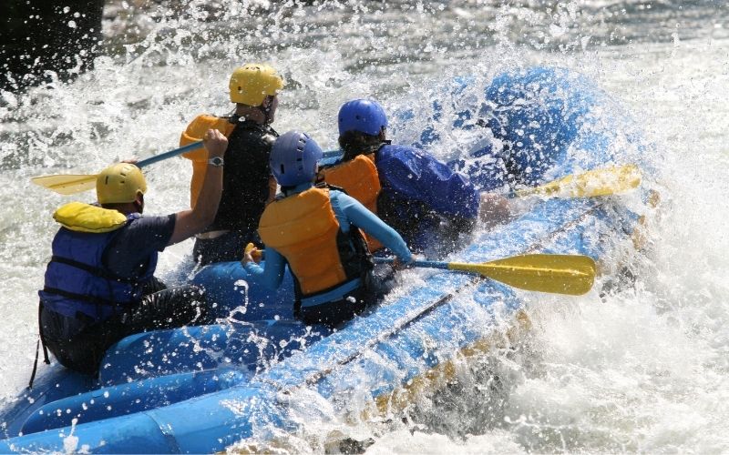 to paddle whitewater in an inflatable kayak