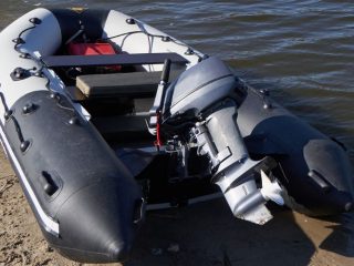 inflatable boat with an attached outboard motor