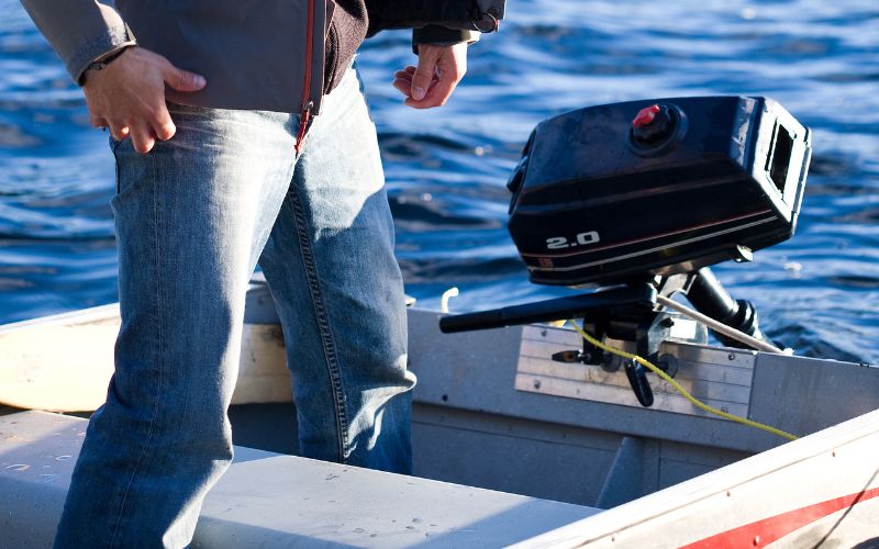 man with his inflatable boat and outboard motor