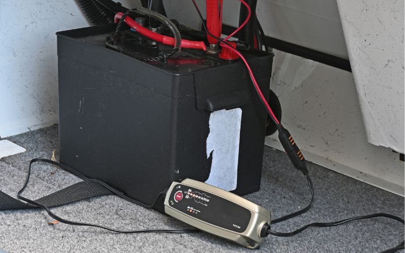 marine battery is charged with a trickle charger on a boat