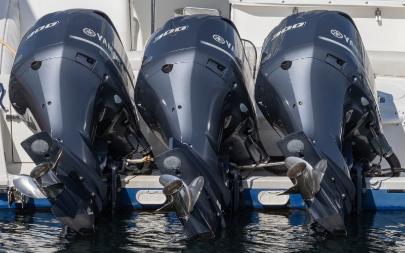 three Yamaha outboard motors on the boat transom