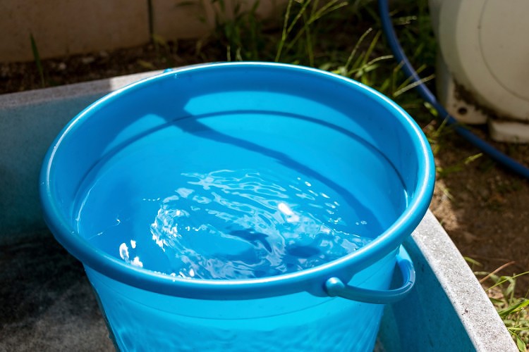 a blue bucket of water