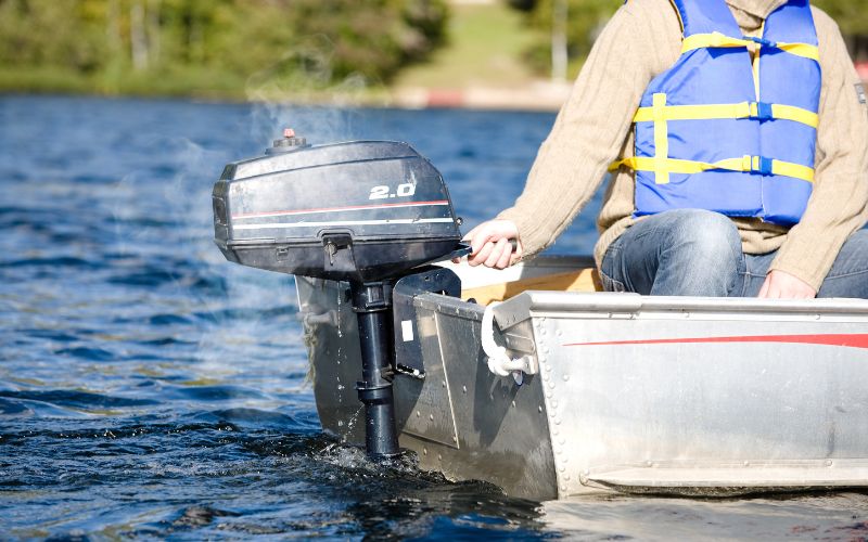 an outboard motor is producing smoke