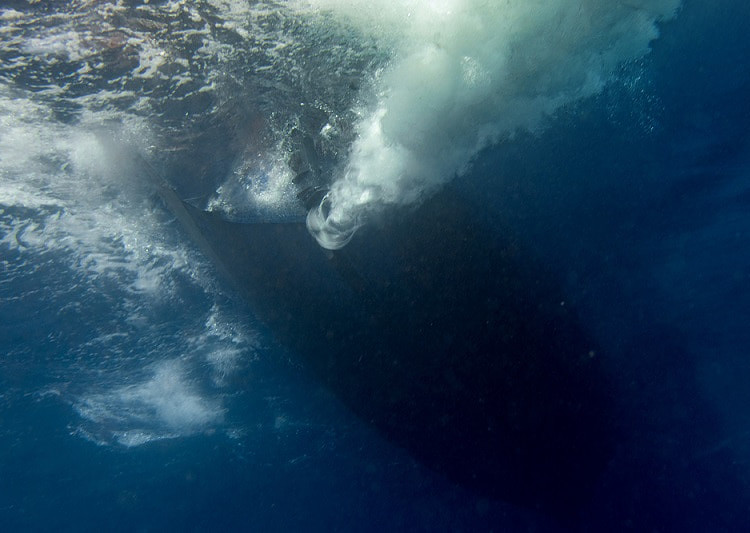 marine engine propeller underwater while diving